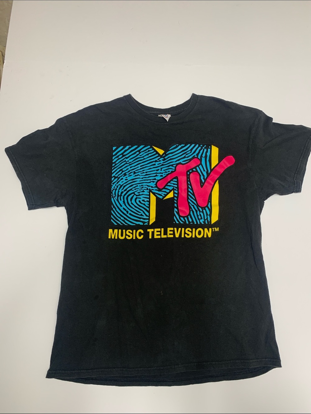 Delta Black Crewneck Tee with Blue, Yellow & Pink MTV Logo